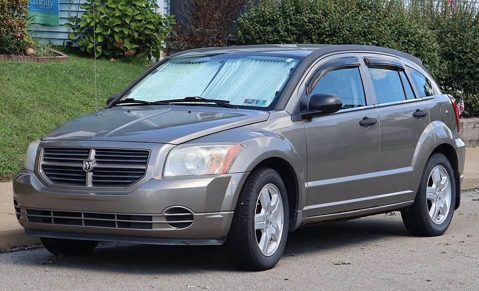 2008 Dodge Caliber SE in Light Khaki Metallic Clearcoat, front left, 09-06-2026