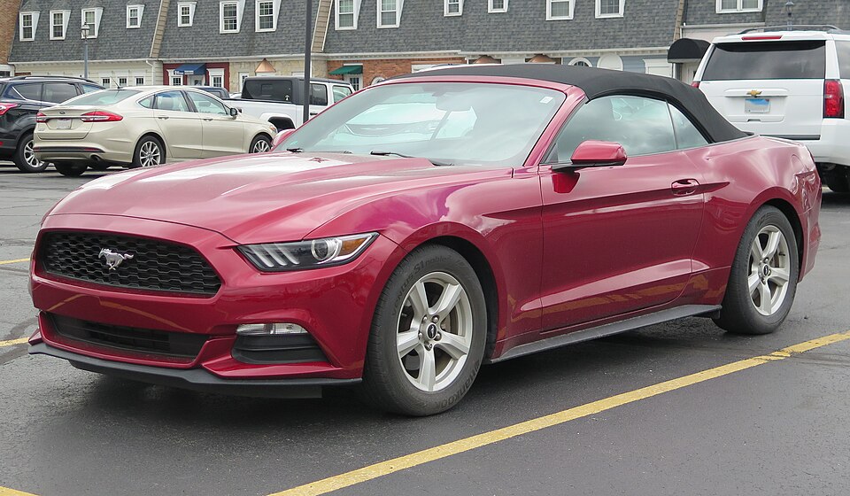 2017 Ford Mustang V6 Convertible in Ruby Red Metallic Tinted Clearcoat, front left, 04-26-2025