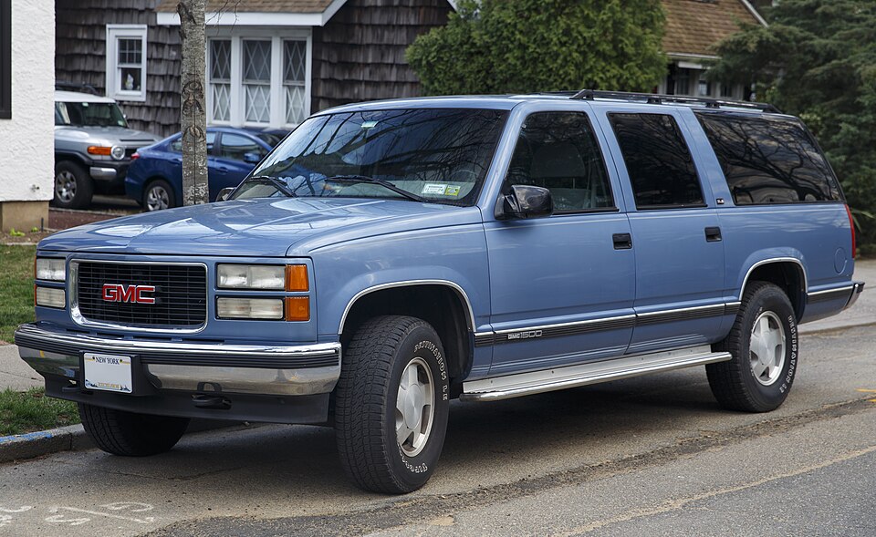 1995 GMC Suburban 1500 4x4 in Atlantic Blue Metallic, front left