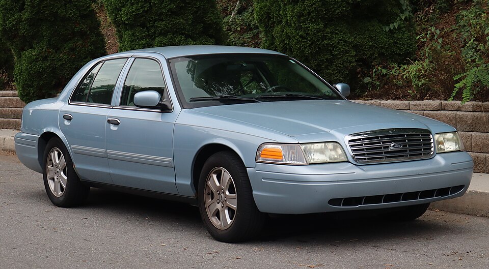 2011 Ford Crown Victoria LX in Light Ice Blue Metallic, front right, 09-12-2026