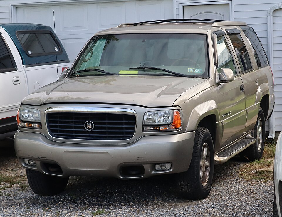 1999 Cadillac Escalade in Silver Sand, front left, 09-19-2026