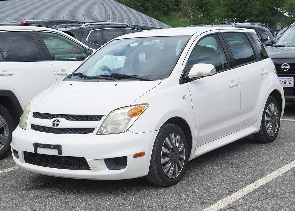 2006 Scion xA in Polar White, front left, 07-09-2026