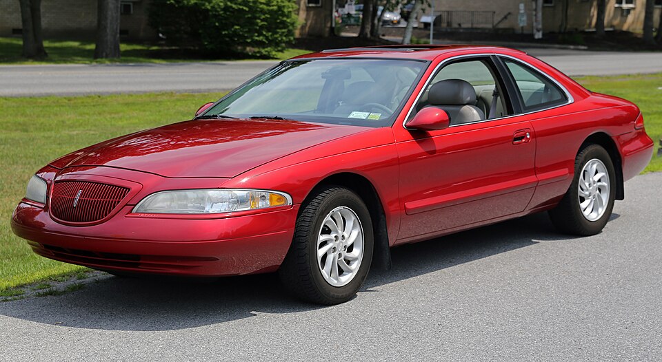1998 Lincoln Mark VIII LSC in red, front left