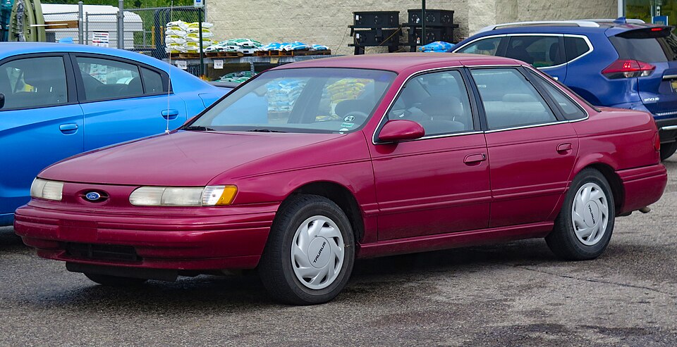 1995 Ford Taurus GL Sedan in Electric Red Clearcoat Metallic, Front Left, 08-12-2023