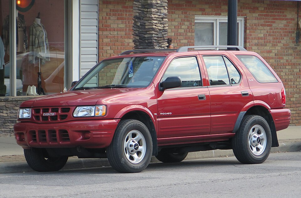 2000 Isuzu Rodeo LS in Palazzo Red Mica, front left, 08-16-2025