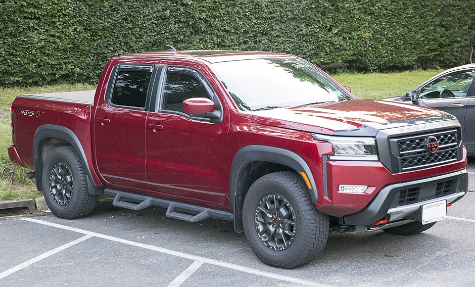 2023 Nissan Frontier Crew Cab PRO-4S in Cardinal Red, front left