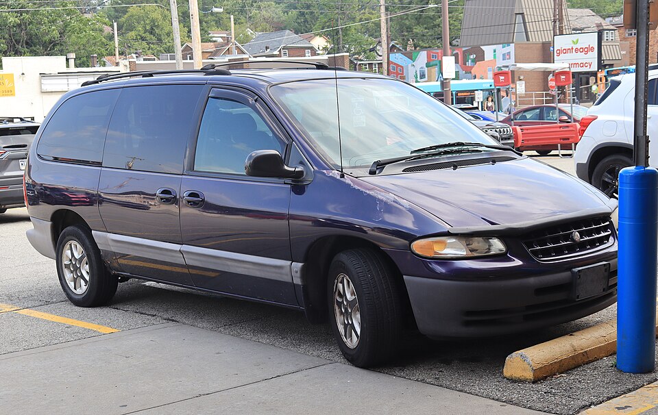 1998 Plymouth Grand Voyager SE in Deep Cranberry Pearl, front right, 08-08-2026