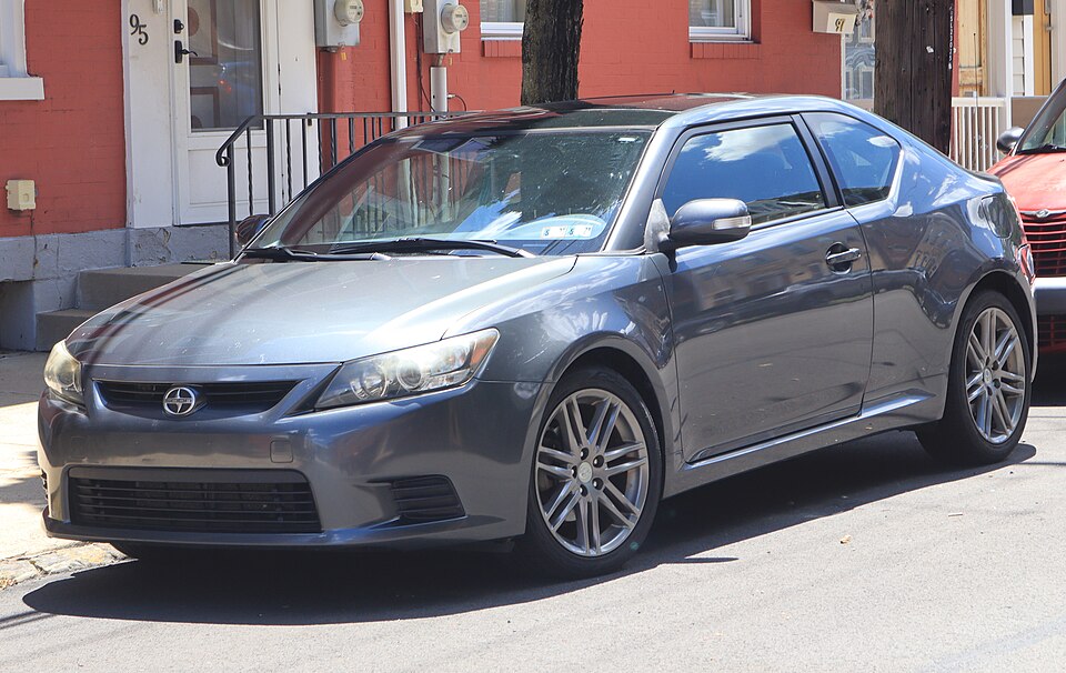 2013 Scion tC in Magnetic Gray Metallic, front left, 06-13-2026