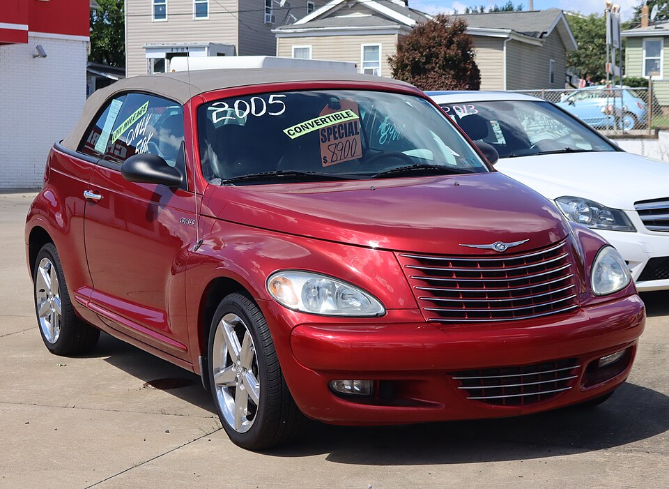 2005 Chrysler PT Cruiser Touring Convertible in Inferno Red Crystal Pearl, front right, 09-06-2026