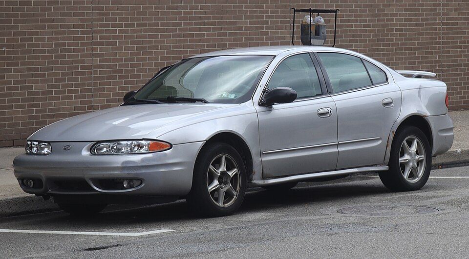 2002 Oldsmobile Alero GL in Sterling Metallic, front left, 06-28-2026