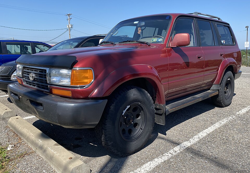 1996 Toyota Land Cruiser in Medium Red Pearl, front left, 07-03-2022