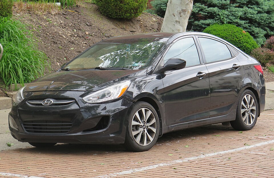 2016 Hyundai Accent SE sedan in Ultra Black Pearl, front left, 05-16-2026