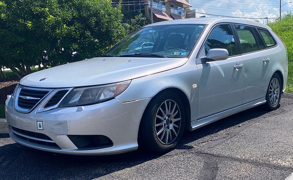 2008 Saab 9-3 2.0T SportCombi in Snow Silver Metallic, front left, 08-26-2022
