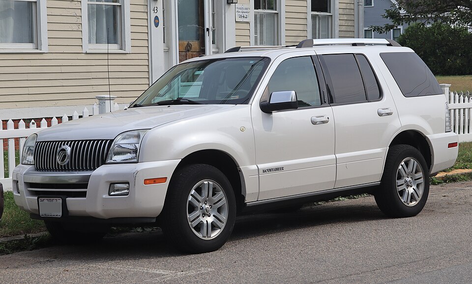 2010 Mercury Mountaineer Premier in White Platinum Tri-Coat Metallic, front left, 07-05-2026