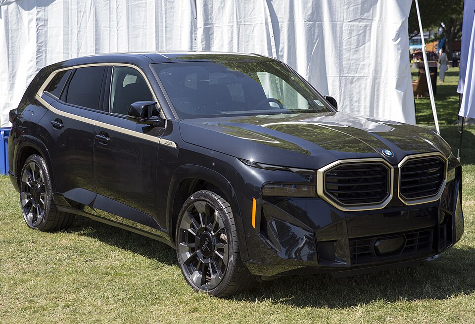 2023 BMW XM in Black Sapphire and NightGold, front right