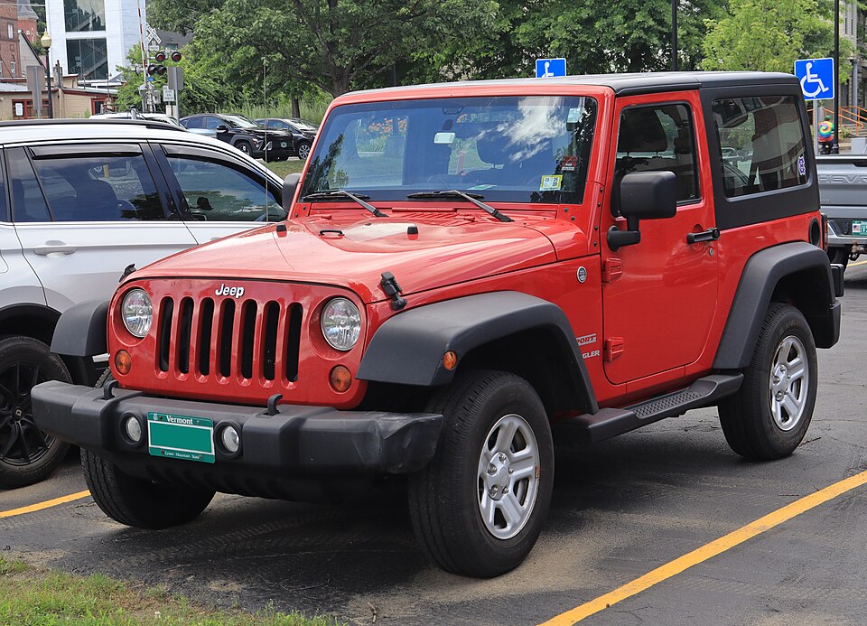 2011 Jeep Wrangler Sport in Flame Red Clearcoat, front left, 07-10-2026