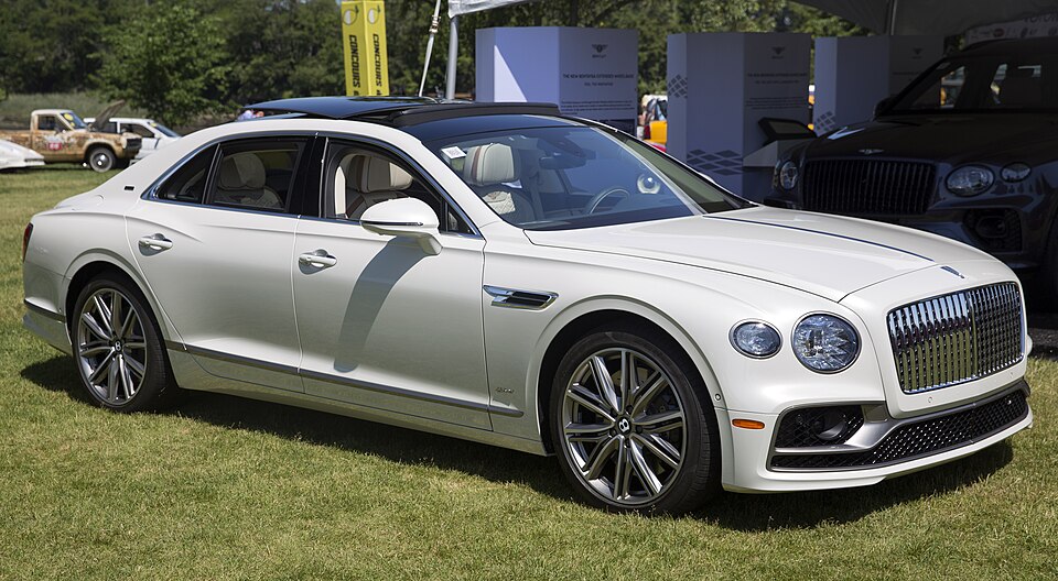 2022 Bentley Flying Spur Hybrid in Ghost White, Odyssean Specs, front right