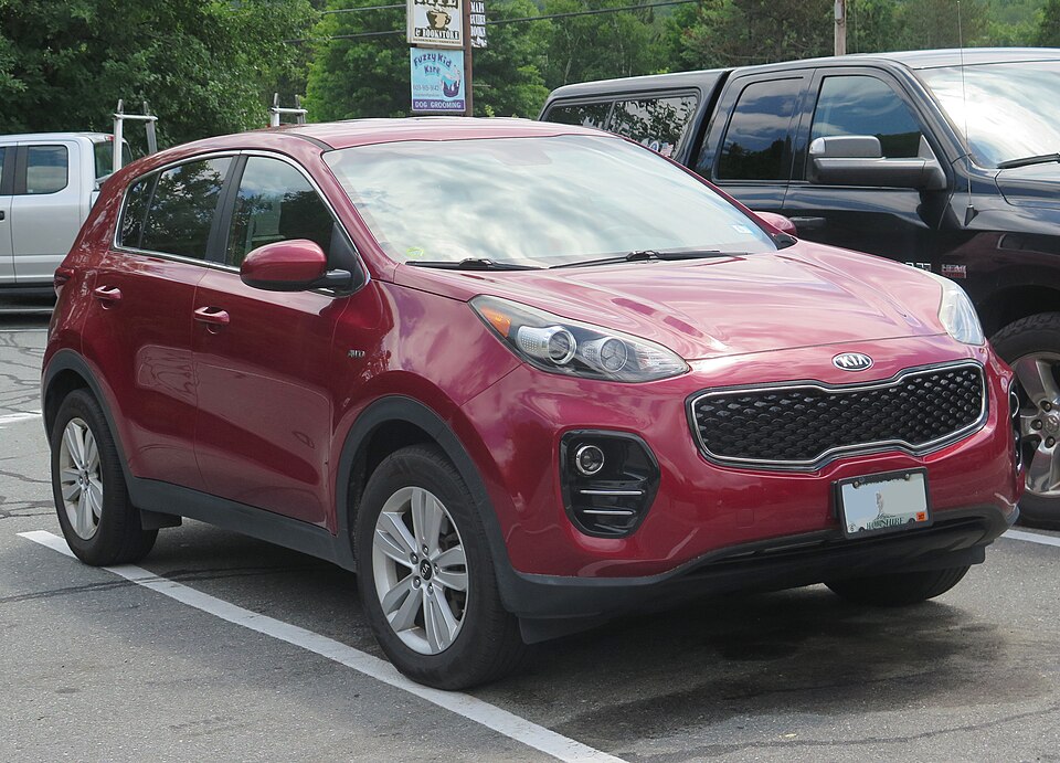 2018 Kia Sportage LX in Hyper Red, front right, 07-09-2026