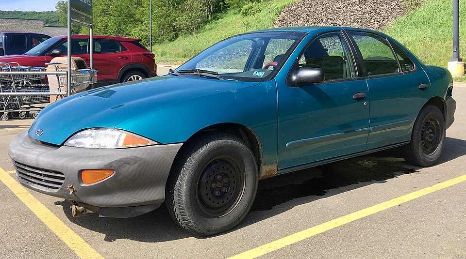 1995 Chevrolet Cavalier base in Bright Aqua Metallic, front left, 05-31-2021