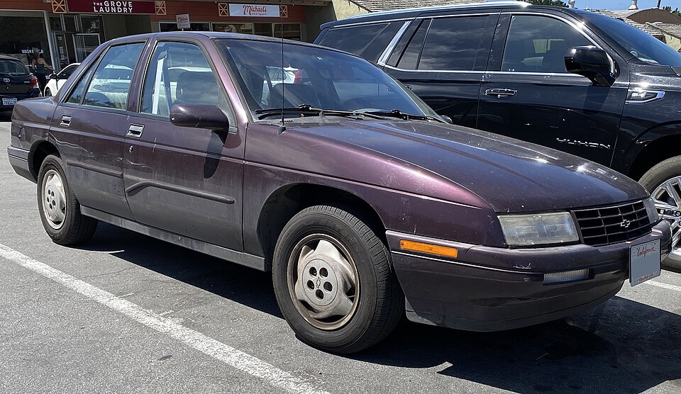 1996 Chevrolet Corsica Base in Black Rose Metallic, front right, 08-13-2022