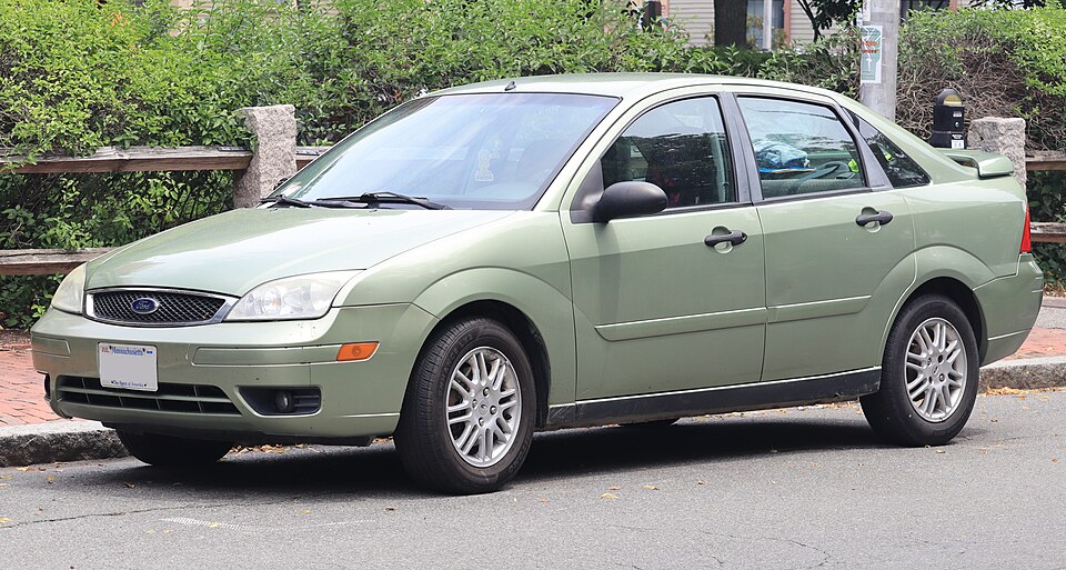 2007 Ford Focus SES sedan in Kiwi Green Metallic, front left, 07-06-2026