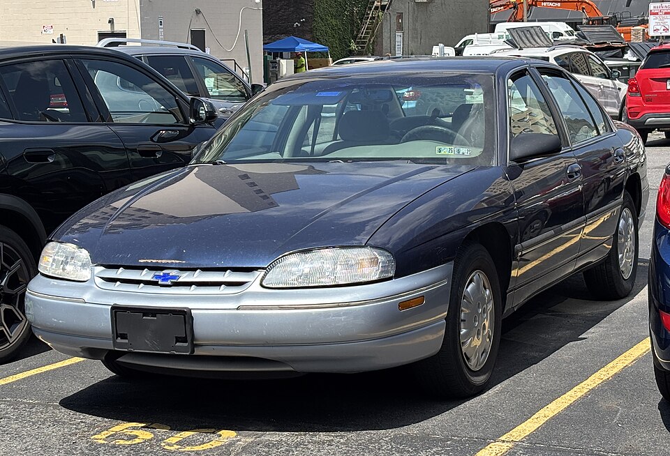 1999 Chevrolet Lumina in Navy Blue Metallic, front left, 07-02-2026