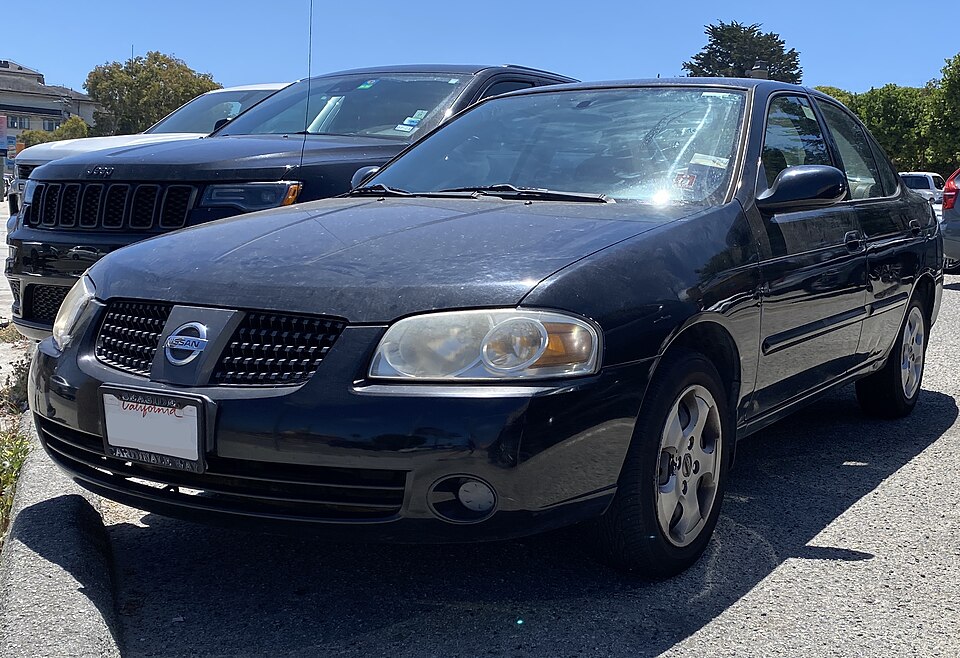 2005 Nissan Sentra 1.8S in Blackout, front left, 08-13-2022