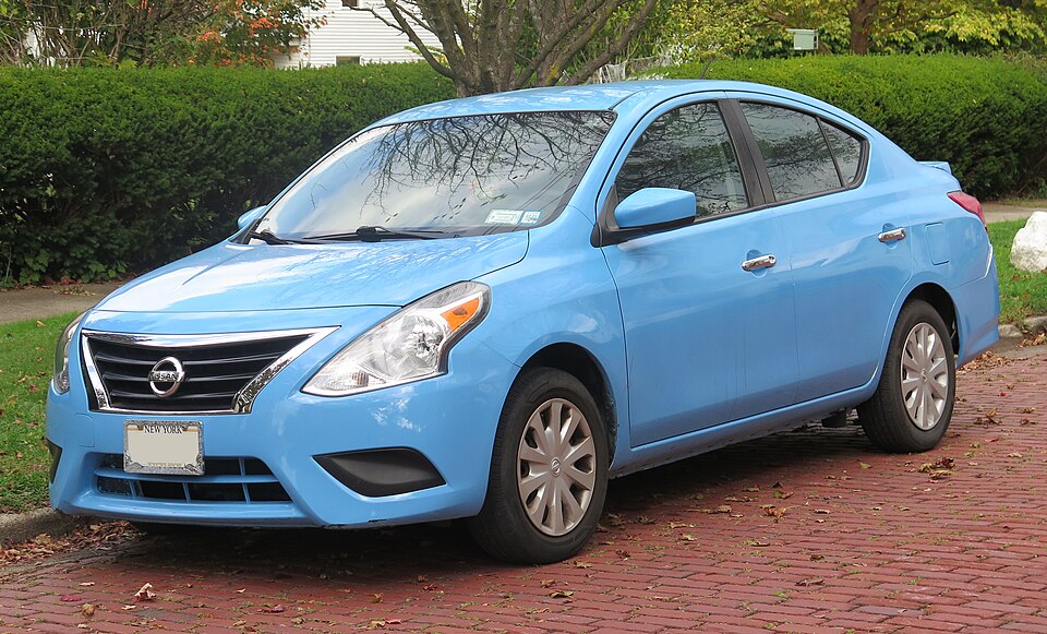 2018 Nissan Versa in cyan (resprayed), front left, 10-11-2025