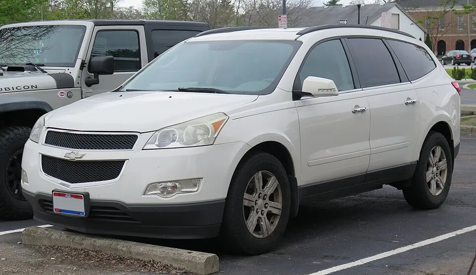 2011 Chevrolet Traverse LT in White Diamond Tricoat, front left, 04-26-2025, photographed in United States