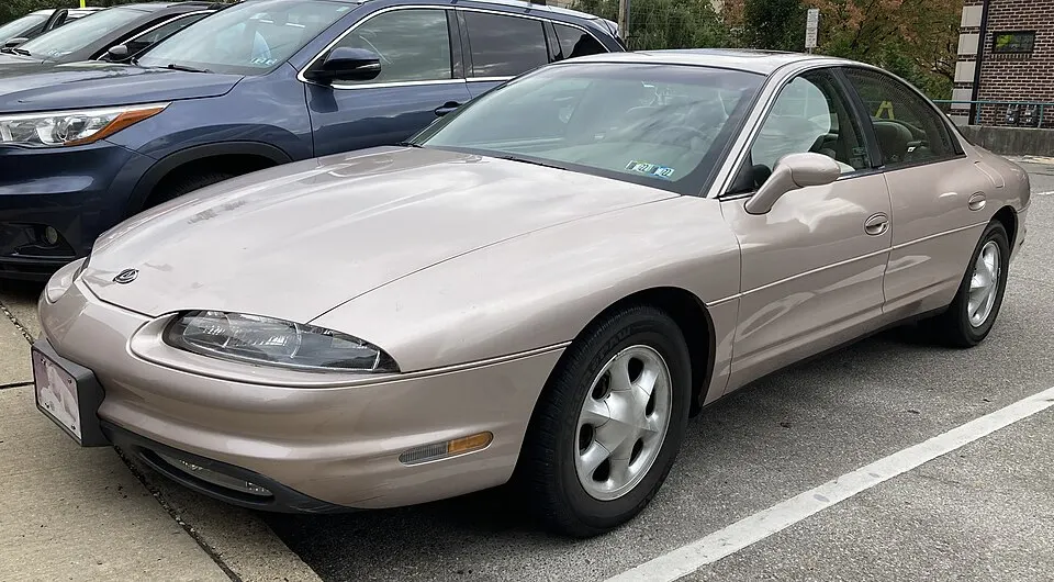 1998 Oldsmobile Aurora in Champagne Metallic, front left, 10-7-2021, photographed in United States