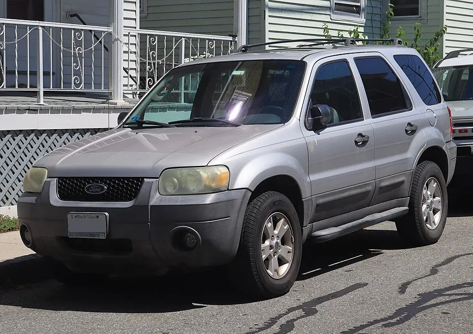 2005 Ford Escape XLT in Silver Metallic, front left, 07-04-2026, photographed in United States