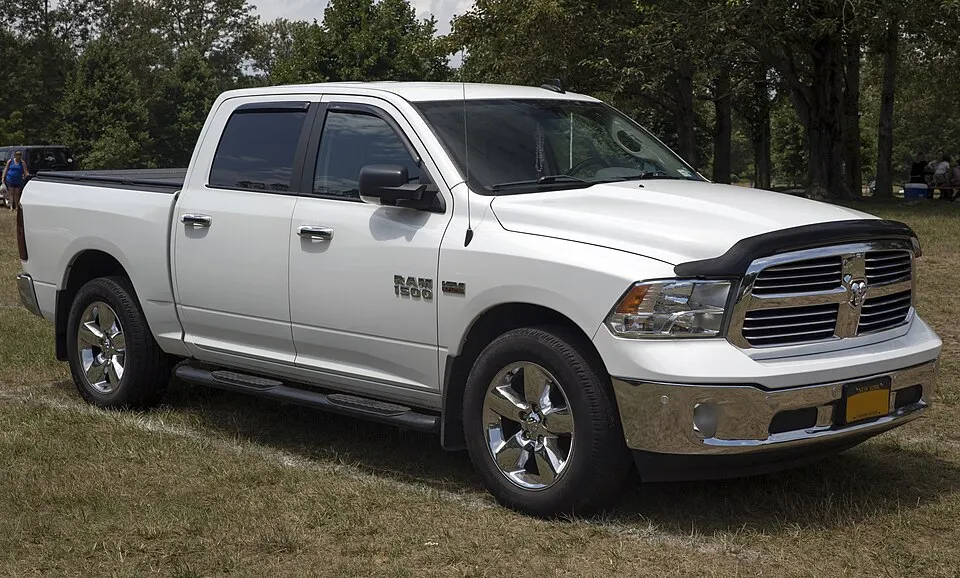 2016 Ram 1500 SLT Crew Cab in white, front right, photographed in United States
