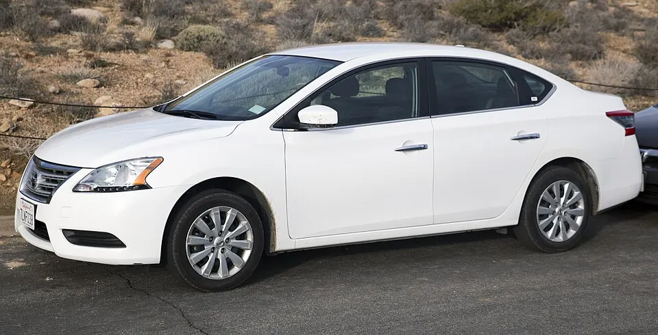2015 Nissan Sentra S (6MT), front left, photographed in United States