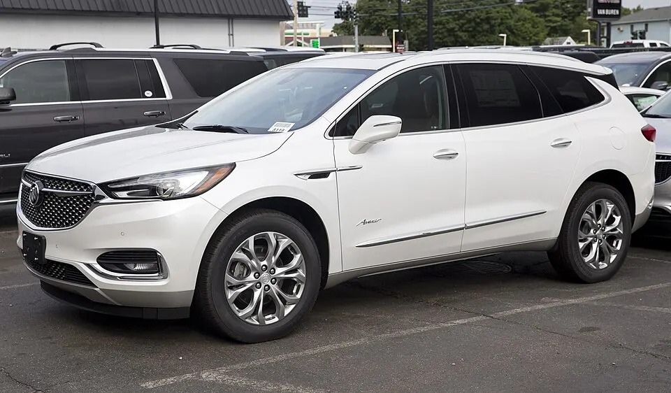 2018 Buick Enclave Avenir AWD (white), front left, photographed in United States