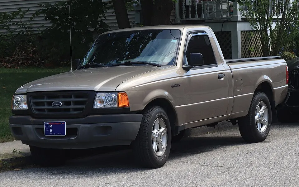 2003 Ford Ranger XL Regular Cab in Arizona Beige Metallic, front left, 07-04-2026, photographed in United States