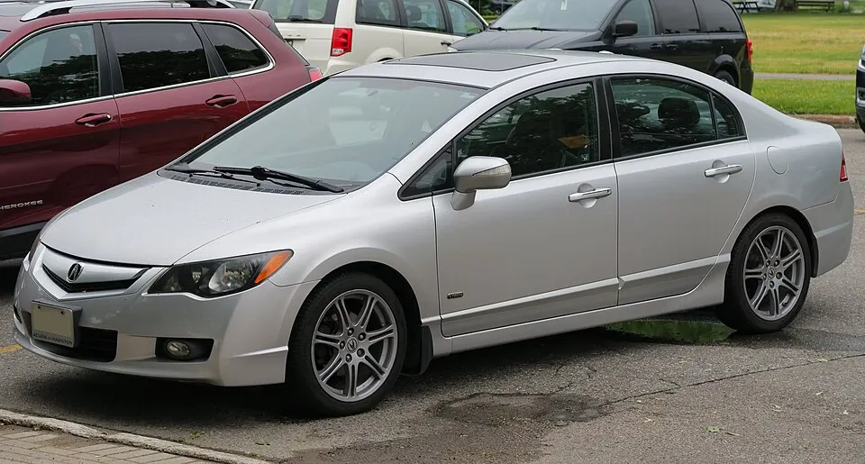2011 Acura CSX i-Tech in Alabaster Silver Metallic, front left, 2025-06-21, photographed in Canada