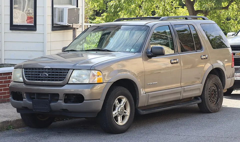 2002 Ford Explorer XLT in Harvest Gold Metallic, front left, 09-19-2026, photographed in United States