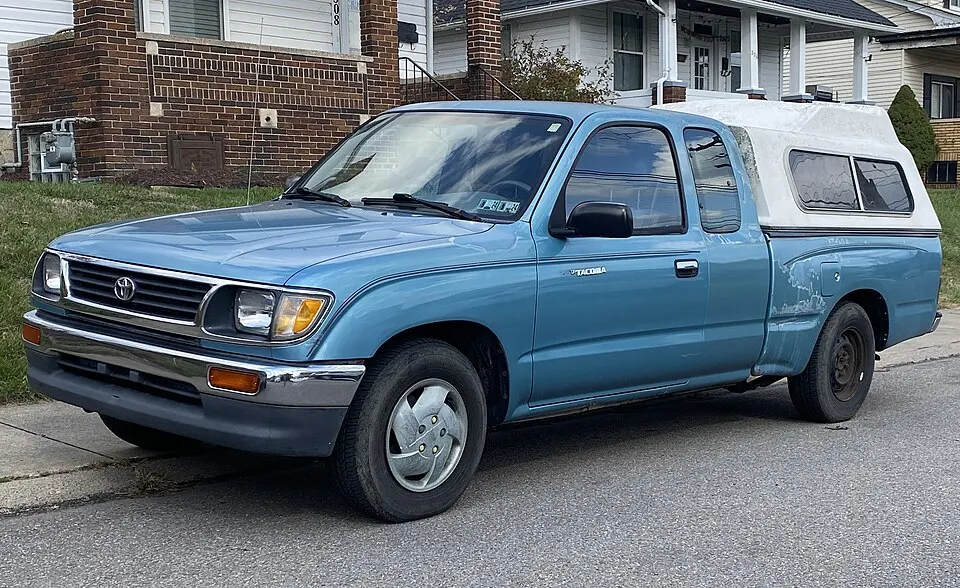 1995 Toyota Tacoma LX in Paradise Blue Metallic, front left, 11-05-2023, photographed in United States