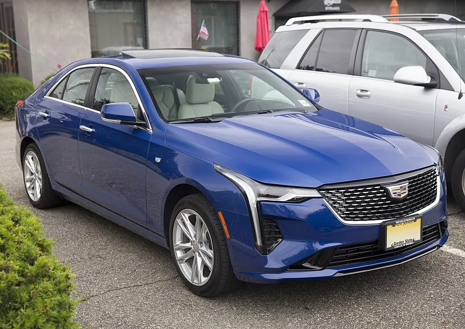 2021 Cadillac CT4 Luxury 350T AWD in Wave Metallic, front right, photographed in United States