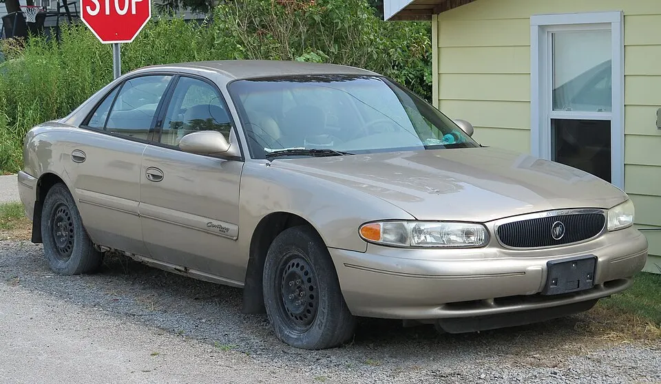 2002 Buick Century Custom in Light Sandrift Metallic, front right, 08-16-2025, photographed in United States