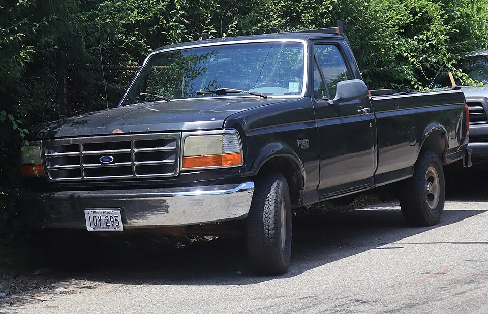 1995 Ford F-150 XL in Black, front left, 07-04-2026, photographed in United States