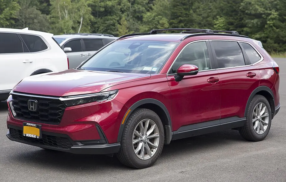 2023 Honda CR-V EX-L 4WD in Radiant Red Metallic, front left, photographed in United States