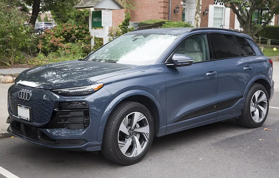 2025 Audi Q6 e-tron quattro Premium Plus in Plasma Blue, front left, photographed in United States