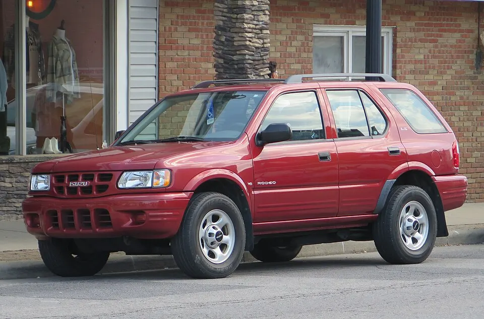 2000 Isuzu Rodeo LS in Palazzo Red Mica, front left, 08-16-2025, photographed in United States