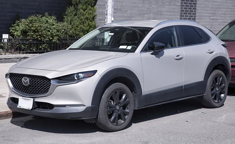 2024 Mazda CX-30 Select in Platinum Quartz, front left, photographed in United States