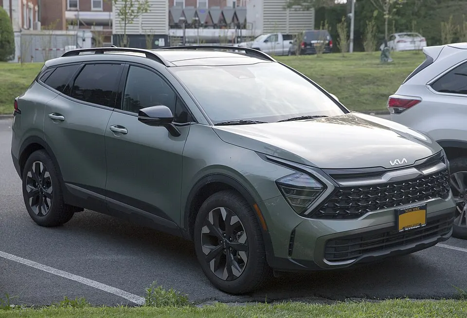 2024 Kia Sportage X Line in Jungle Green, front right, photographed in United States