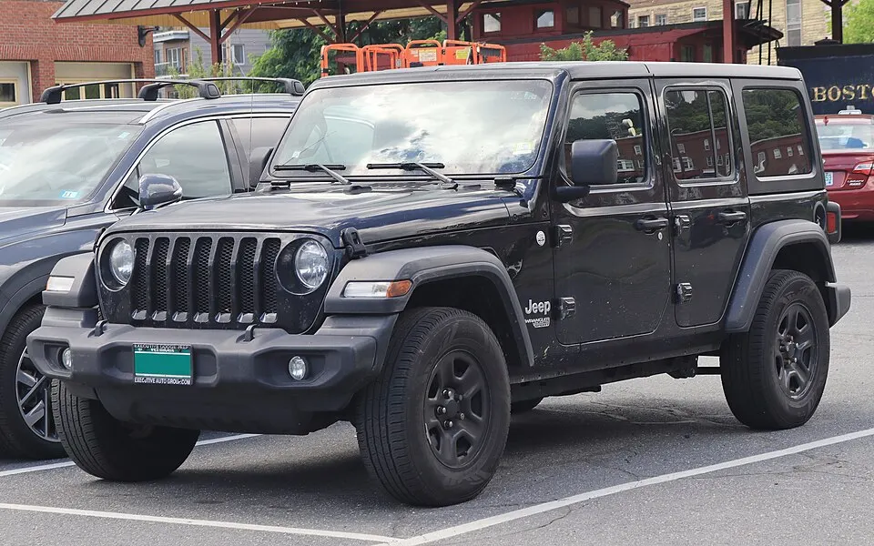 2019 Jeep Wrangler Unlimited Sport in Black Clearcoat, front left, 07-10-2026, photographed in United States