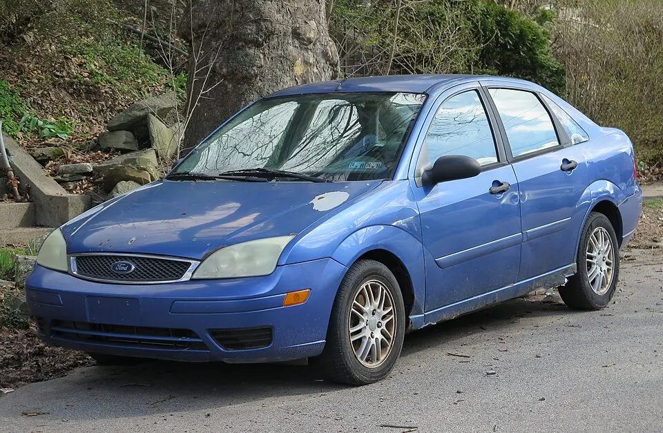 2005 Ford Focus SE ZX4 in Sonic Blue Metallic, front left, 03-28-2026, photographed in United States