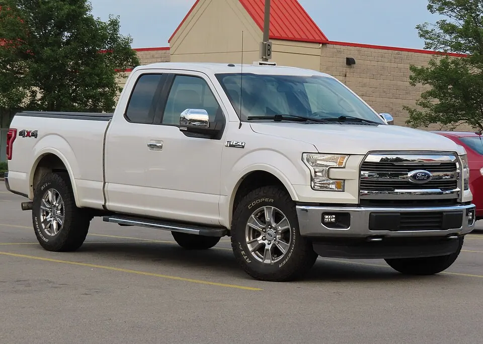 2015 Ford F-150 Lariat SuperCab 4x4 with Lariat Chrome package, front right, 06-22-2024, photographed in United States