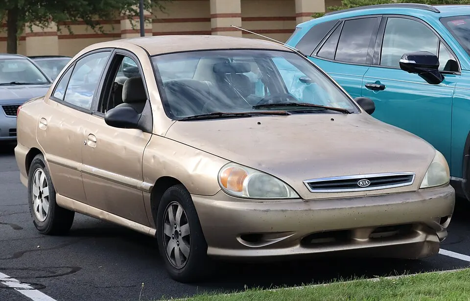 2002 Kia Rio in Light Gold, front right, 09-18-2026, photographed in United States